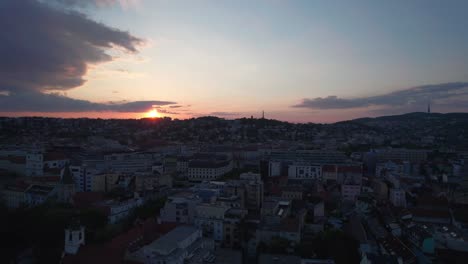 Stunning-aerial-view-of-Bratislava-cityscape-at-sunset,-rising-above-city