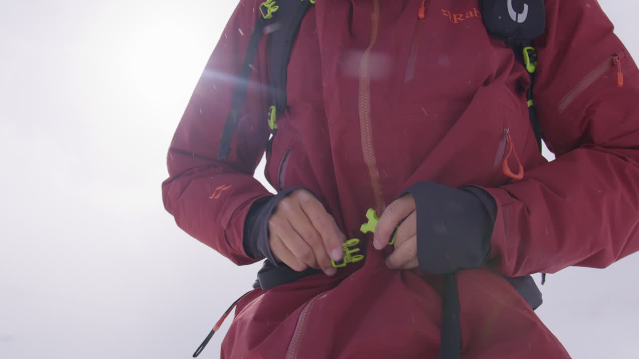 Two freeriders ski tour up the majestic Alphubel with their guide, then descend through glacial terrain surrounded by crevasses and seracs in the high alpine landscape of Saas-Fee