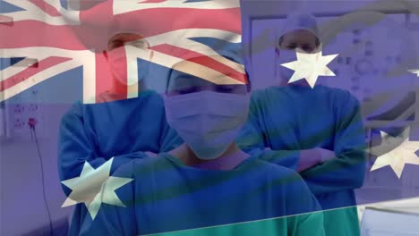 Die-Australische-Flagge-Weht-Vor-Dem-Porträt-Eines-Chirurgenteams,-Das-Im-Krankenhaus-Gesichtsmasken-Trägt