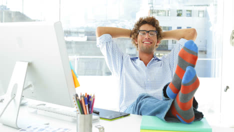 Tired-businessman-reclining-on-his-swivel-chair-