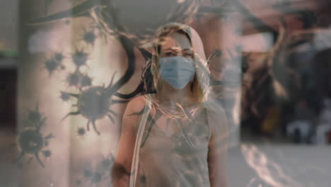 animation of covid 19 cells moving over woman in face mask