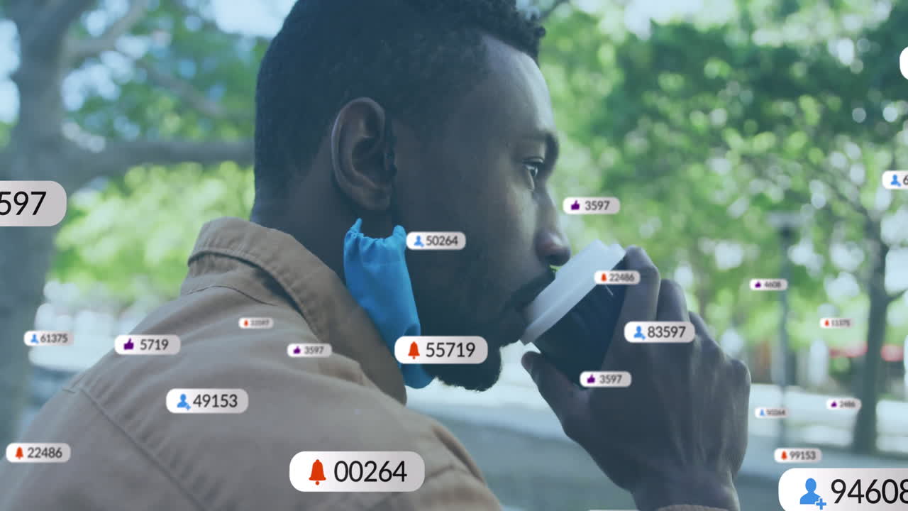 Drinking coffee, man receiving social media notifications with animation overlay