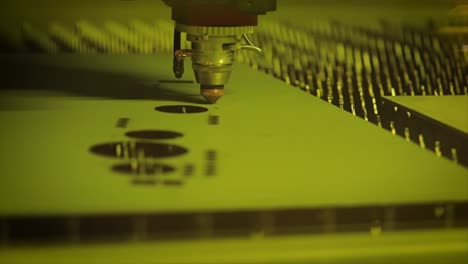 CNC-Laser-cutting-of-metal-in-slow-motion,-modern-industrial-technology.