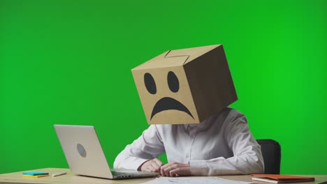 Person with a Box on Head, Looking Unhappy