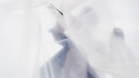 low angle view of african american man putting garbage in a plastic bag