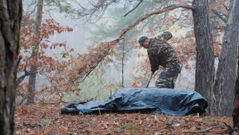 a criminal digs the body of his victim in the forest