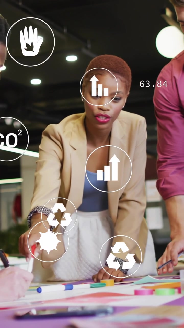 Vertical video: Lead picking red marker aligning team while sustainability icons overlaying plan
