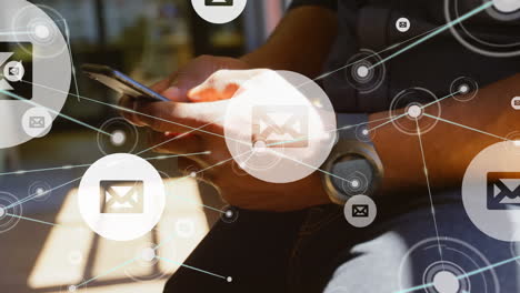 animation of message icons and network of connections over mid section of man using smartphone
