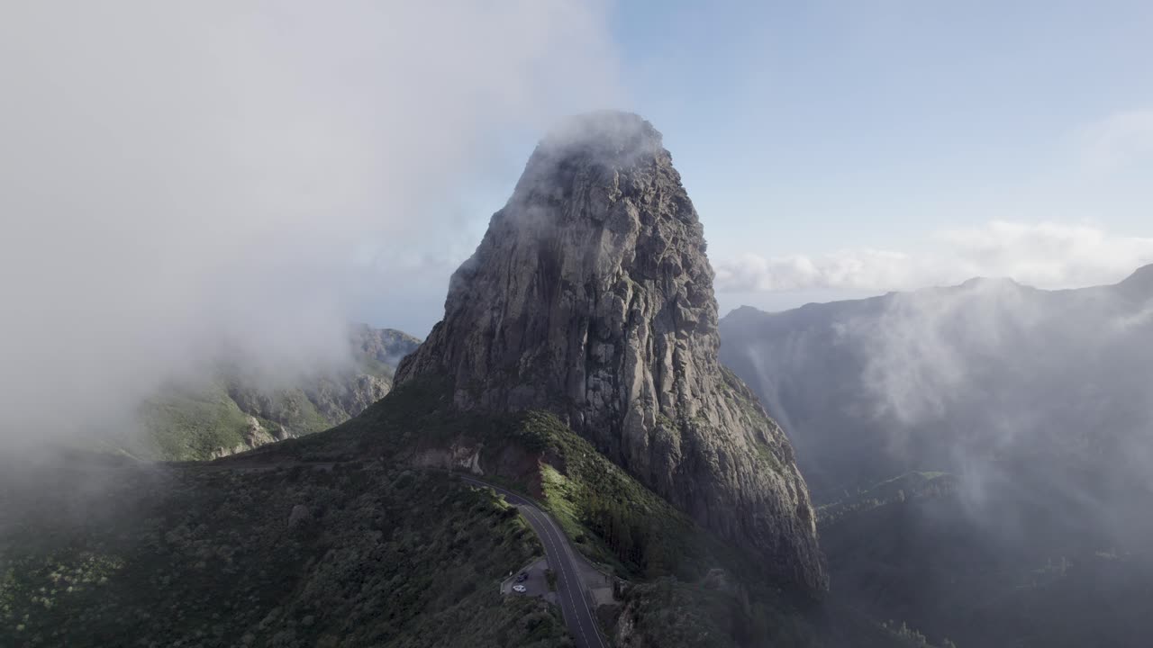 Beautiful view of Roque de Agando shrouded in a cloud, a symbol of the island of La Gomera.