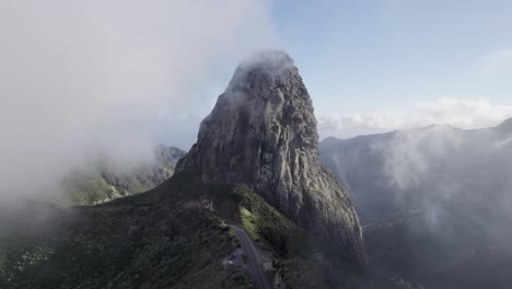 beautiful view of roque de agando shrouded in a cloud, a symbol of the island of la gomera.
