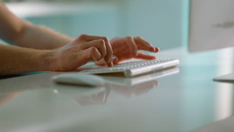 Journalist-hands-typing-article-in-office-closeup.-Unknown-man-working-computer