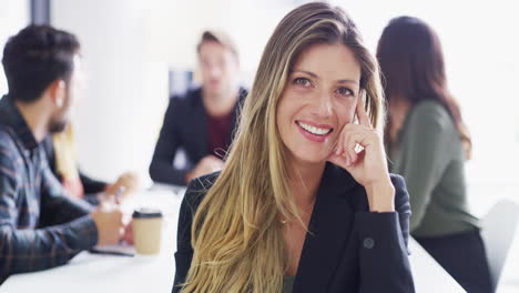 a confident young businesswoman having a boardroom