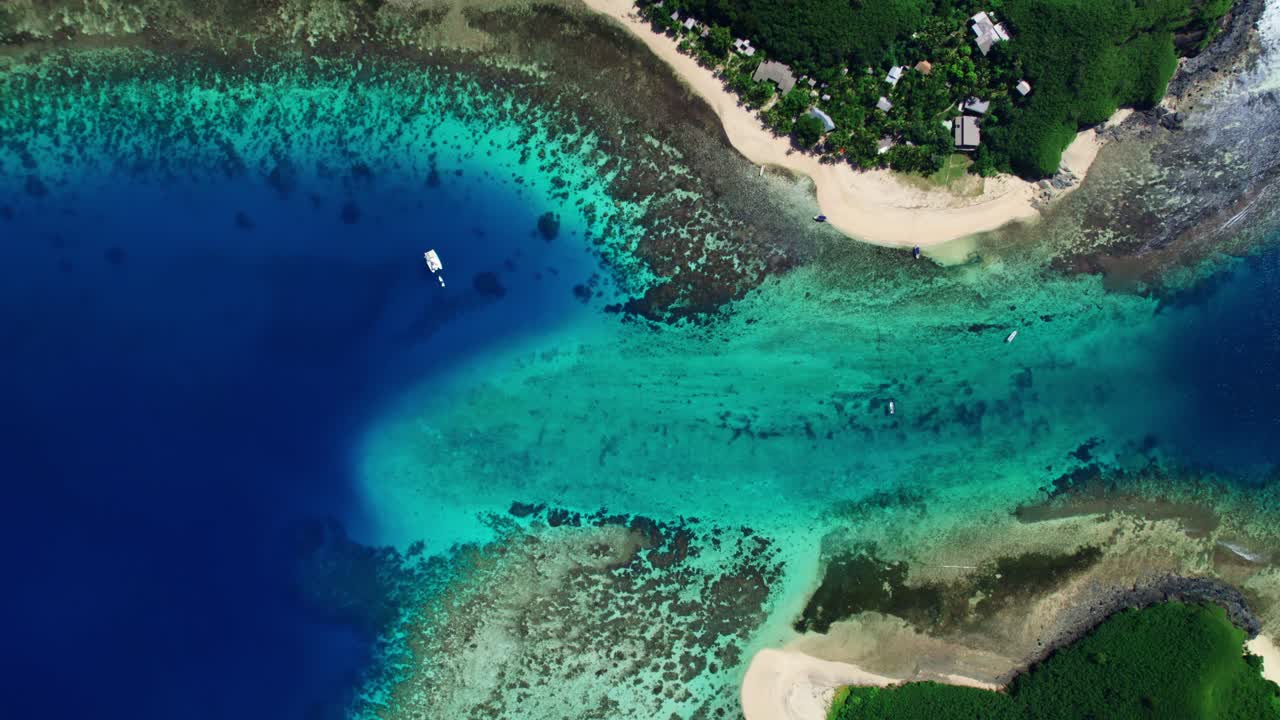 Bird's eye view of water channel and coral reef through Yasawa islands Fiji