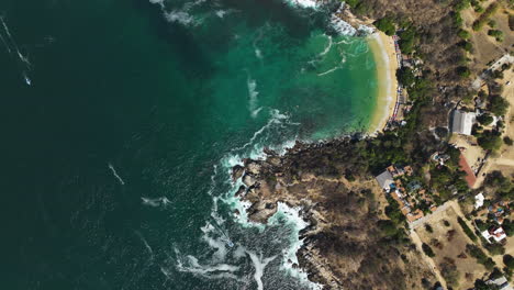 Aerial-view-above-the-coastline-of-Puerto-Escondido,-Mexico---birds-eye,-drone-shot