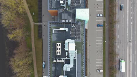 drone shot of office building roof with solar panels, heating, ventilation and air conditioning equipment