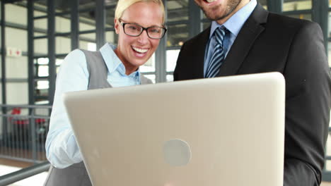 Business-colleagues-using-laptop