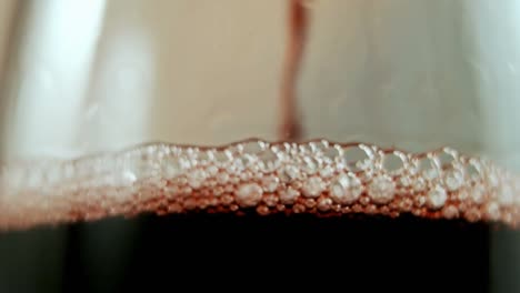 animation of confetti over champagne pouring into glass