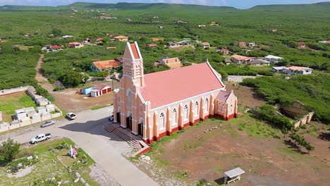 Roman-Catholic-church-of-Sint-Willibrordus-in-neo-gothic-style,-aerial-orbit