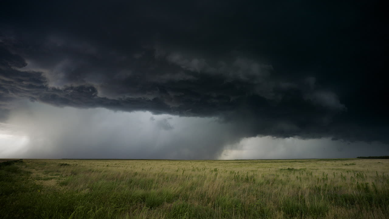 Massive Thunderstorm Over a Field
