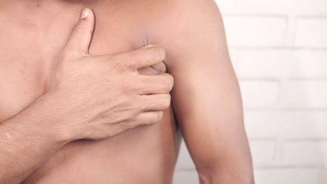 man experiencing chest pain