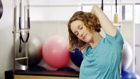 Beautiful-woman-exercising-in-fitness-studio