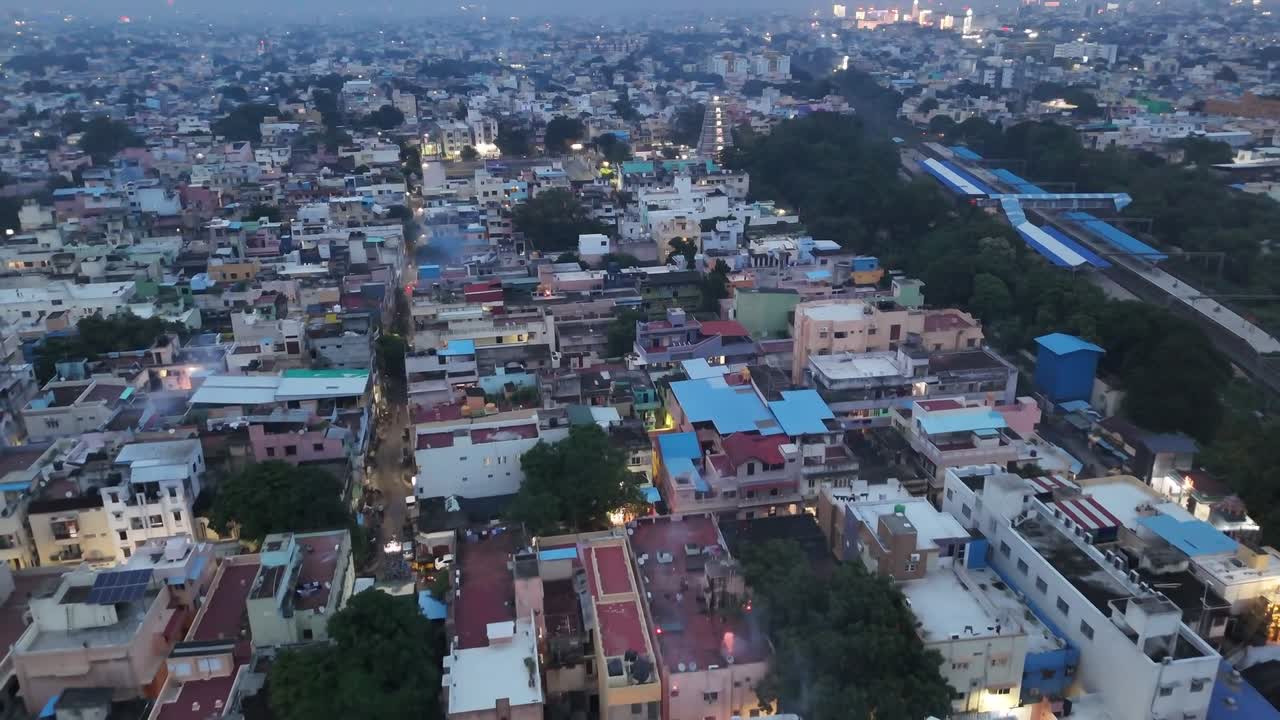 Chennai diwali smoke from nonstop Diwali fireworks hangs over the city skyline, blurring lights and filling the night air with haze. A festive glow mixed with heavy pollution defines the scene