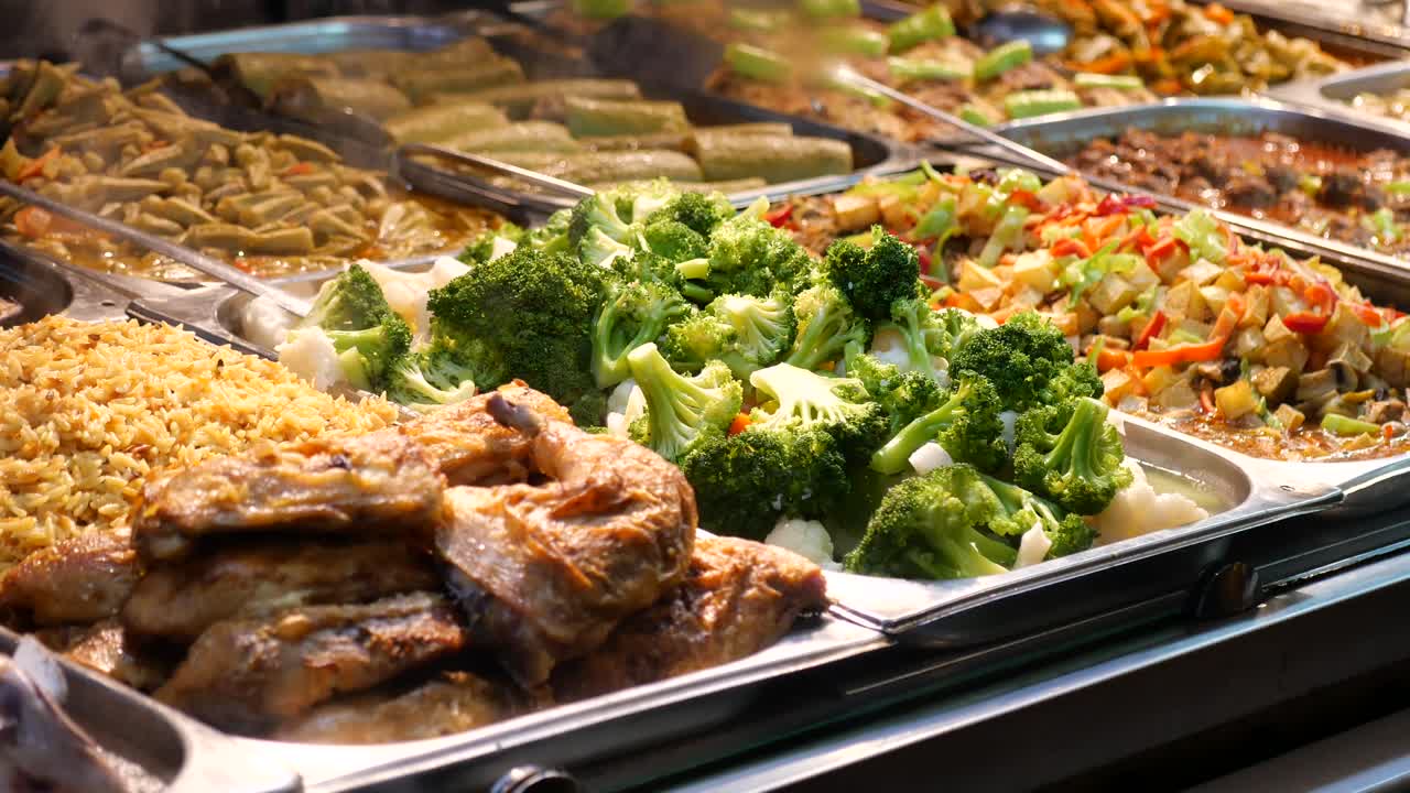 Buffet with chicken, rice, and vegetables