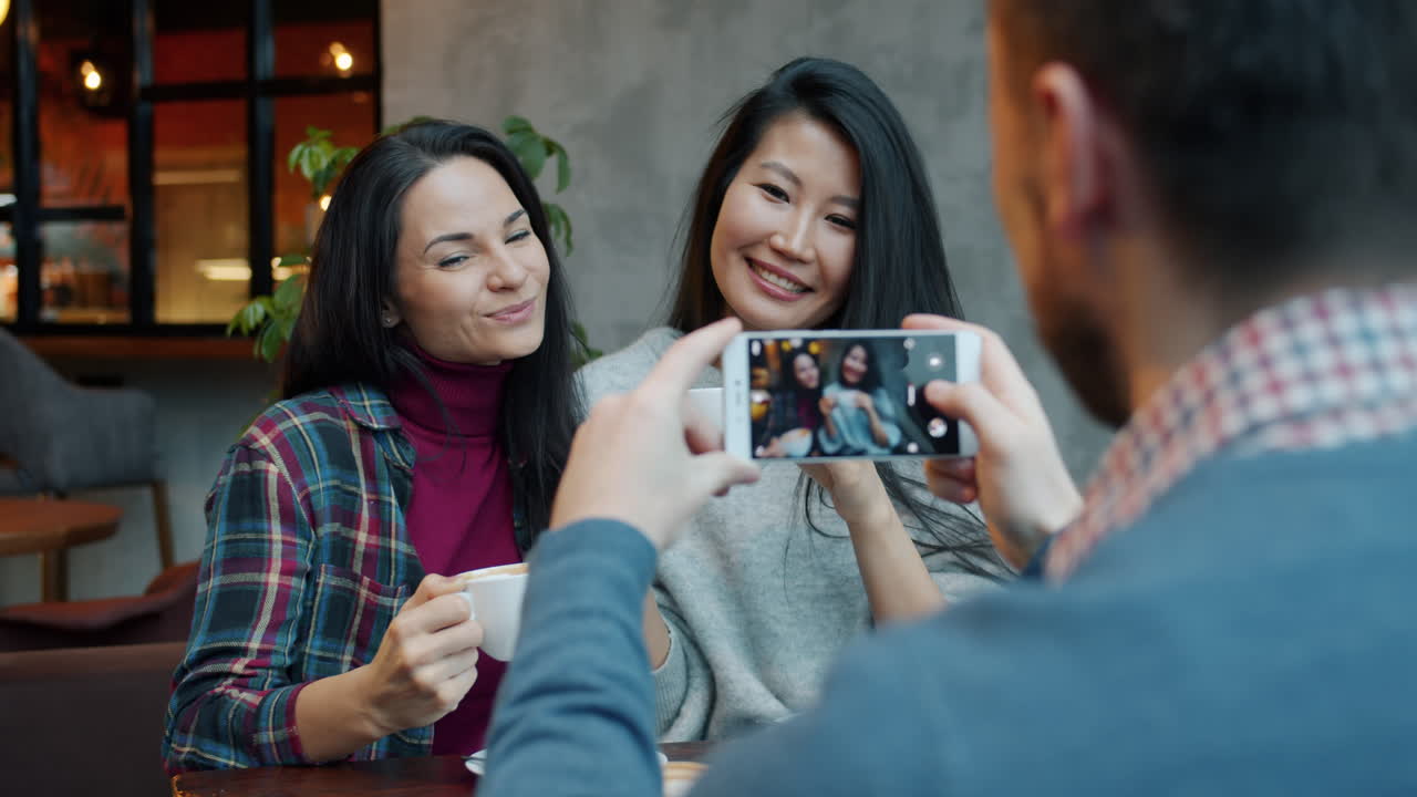 Friends Taking Photo in a Cafe