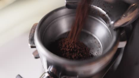 freshly ground coffee filling portafilter