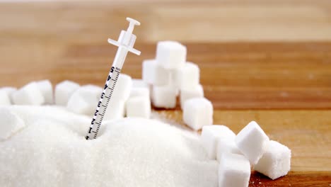 Syringe-in-sugar-powder