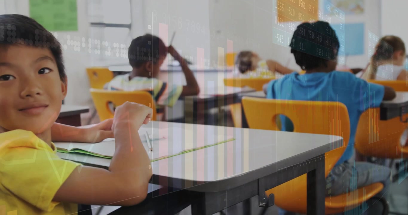 camera panning across classroom writing task then front-row boy placing notebook smiling at camera