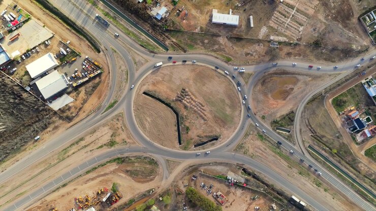 Aerial View of Busy Traffic Flowing Through Highway Roundabout in Rural Area, Argentina