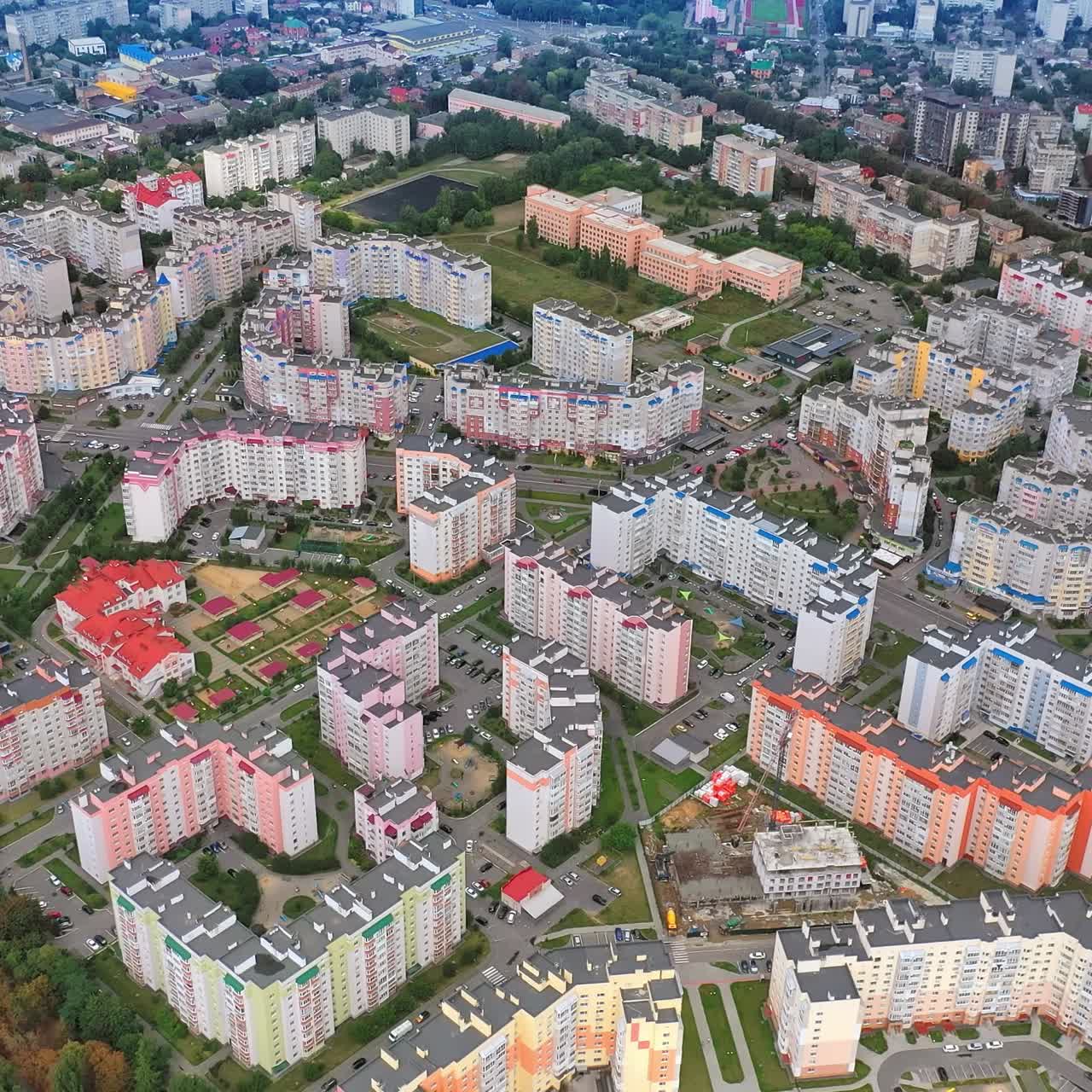 Contemporary district with multi-storey buildings. New apartment buildings of modern design. Residential landmarks in a new district of a city. Aerial view