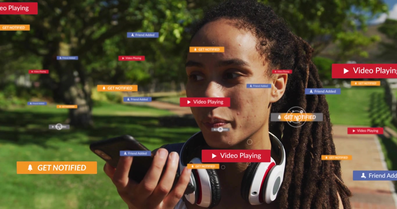 Woman with headphones walking speaking into smartphone managing app alerts growing and fading