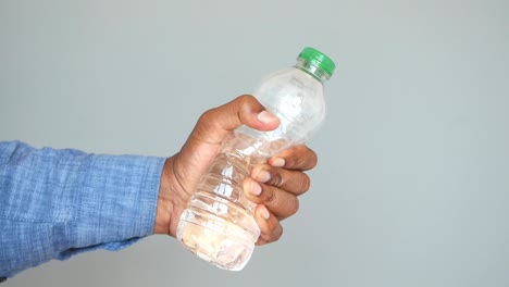 a person holding a water bottle