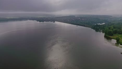 River at sunset. Beautiful view of a huge river in nature landscape. Shining of water at the evening sun. Aerial view.
