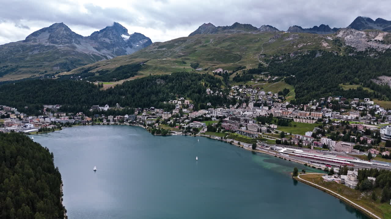Aerial view of Saint Moritz, lake, and mountains in tranquil setting