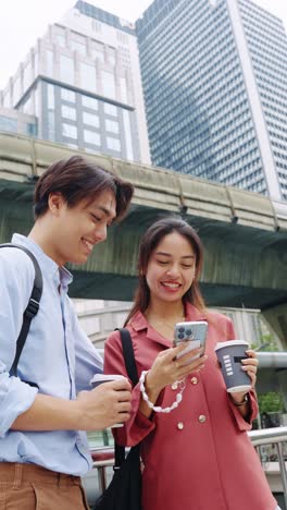 couple looking at phone in the city