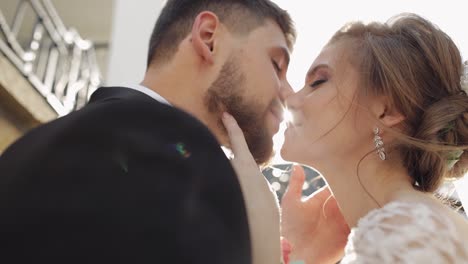 newlyweds. lovely young caucasian bride and groom making a kiss. happy family