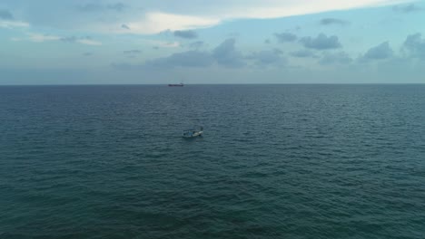 Aerial-shot-of-the-boat-going-in-the-middle-of-the-sea