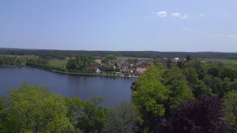 Breathtaking-aerial-top-view-flight-rural-village-Chlum-on-lake-in-czech-republic-Europe,-summer-day-of-2023