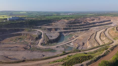 aerial view of quarry site for cement materials in ireland. - pullback shot