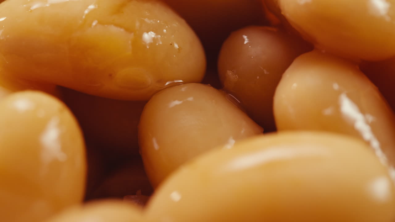 Canned red bans preserved beans rotating background close up side view. Organic steamed beans. Pickled bean for a Mexican dish