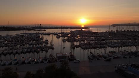 aerial of flisvos port marina in athens capital of greece with luxury boat moored at bay during sunset