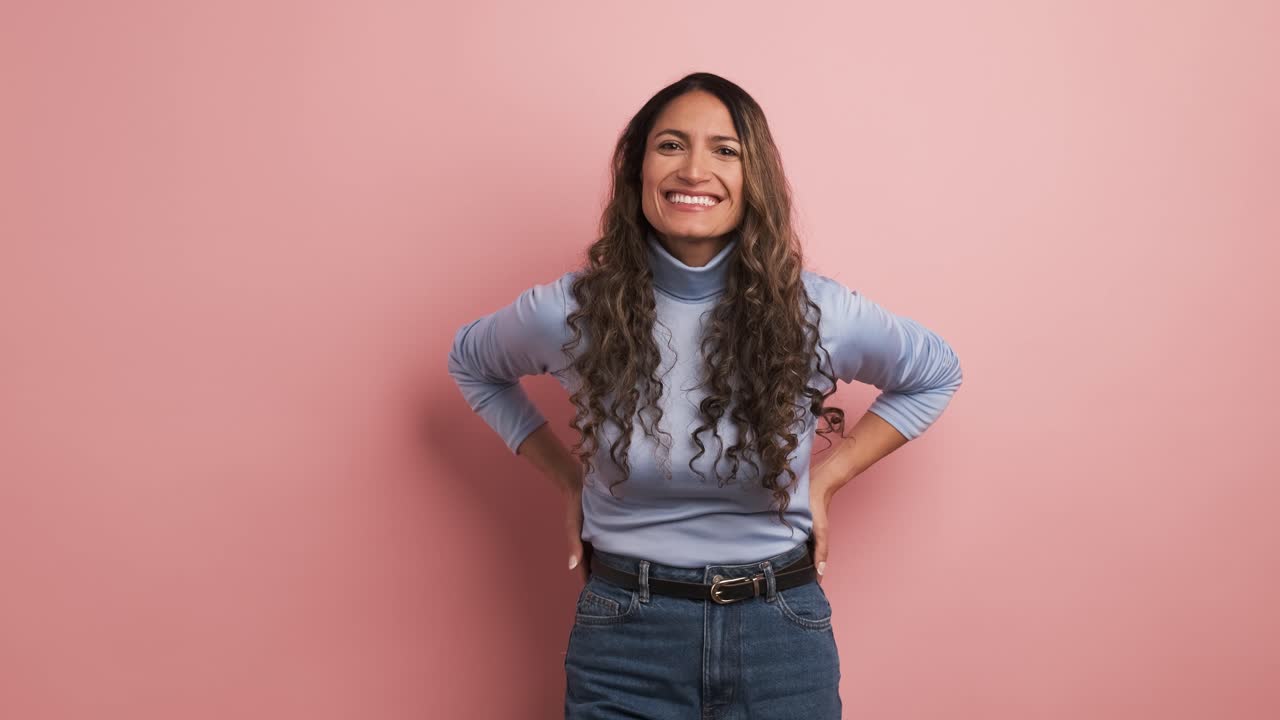 Happy hispanic woman smiling at the camera
