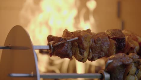 Slow-Motion-Shot-Of-Roast-steak-Beef-Turning-On-Fire,-Barbecue