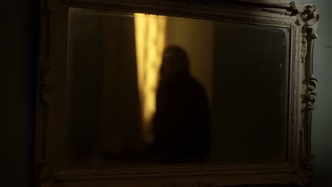 mysterious reflection in an old mirror