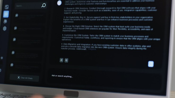 Video of laptop with ai chat on screen on black background