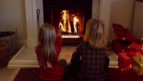 brother and sister at home at christmas time