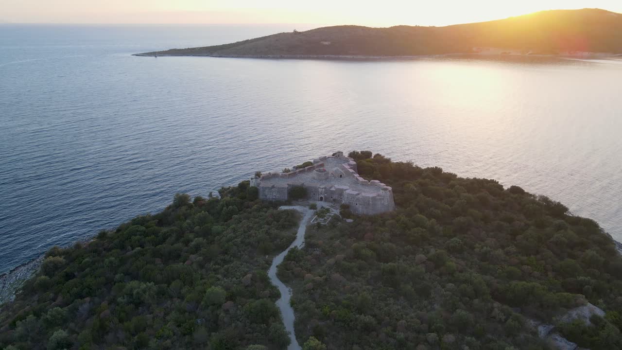 aerial view of Castle of Ali Pasha of Ioannina, a renowned Albanian ruler of the Ottoman Empire's European territories, surrounded by mountains and overlooking the sea